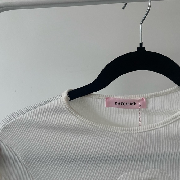 white long sleeve top with heart cut outs - Picture 2 of 2